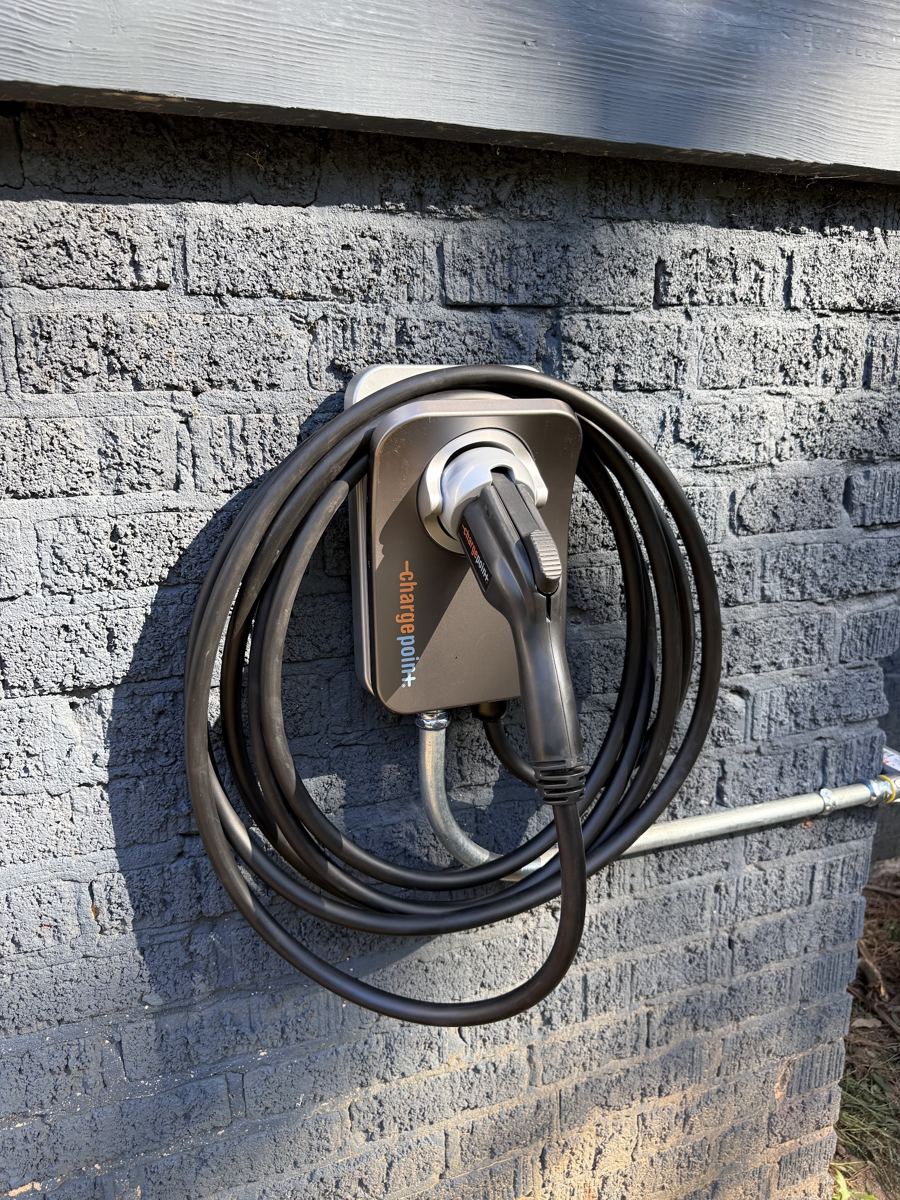 Level 2 EV charger installed on an exterior wall