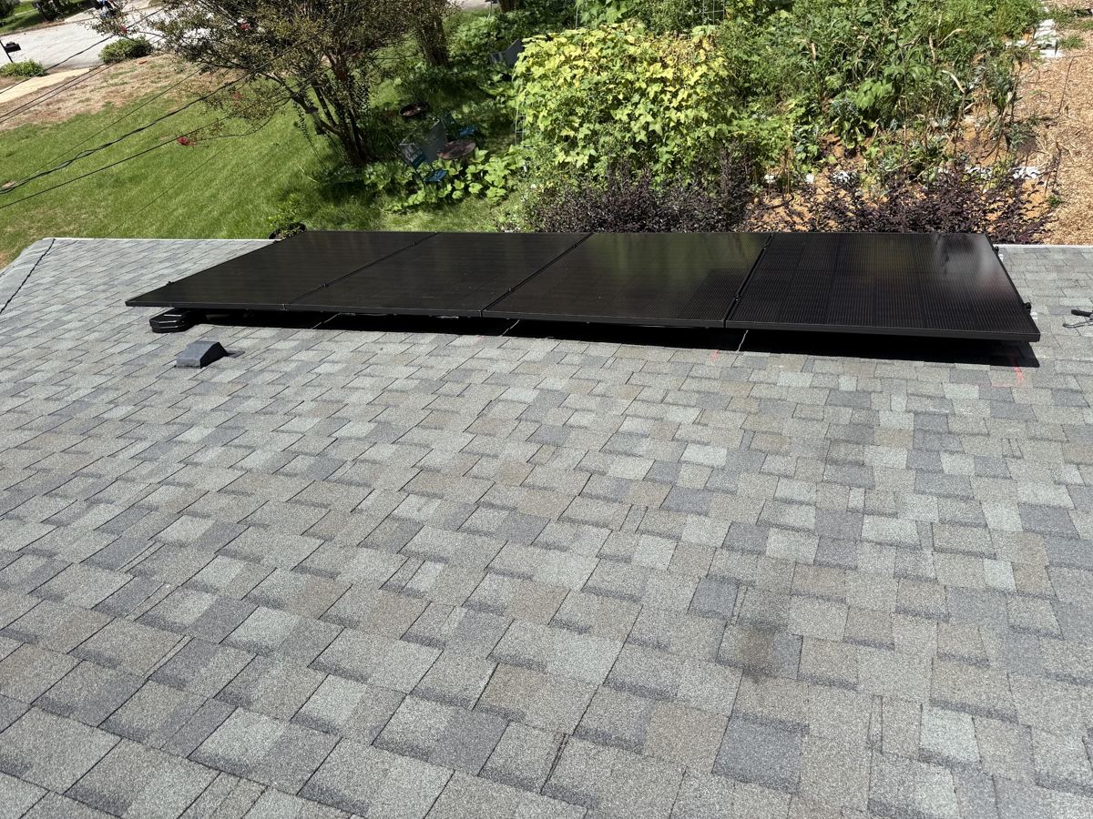 Low-profile solar panels mounted on an asphalt shingle roof